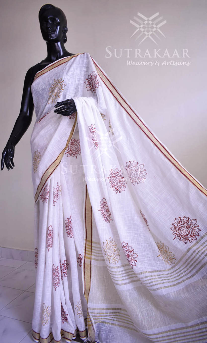 Khadi cotton hand block printed saree. Beautifully textured saree, with a soft handfeel. Zari borders are hand painted in red parallel lines that gives a good lift to the entire design.